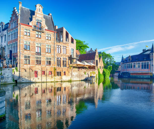Beautiful old buildings along the river Leie in Ghent city, Belgium