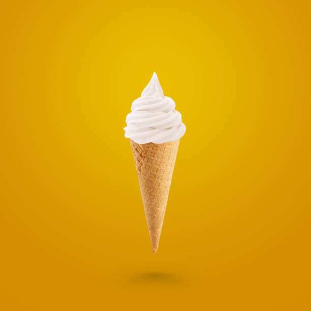 istock Tasty ice cream in a waffle cone on a yellow background 2161629784