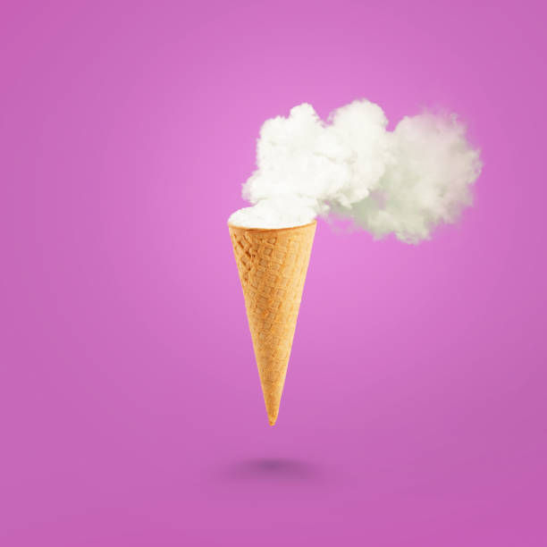 istock Ice cream cone and white smoke on pastel pink background. Flat lay. Global warming concept. 2161629793