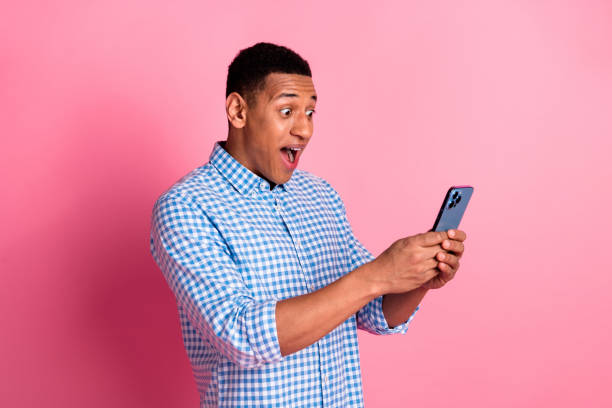 istock Photo of funky impressed guy dressed checkered shirt getting massages modern device emtpy space isolated pink color background 2161633320