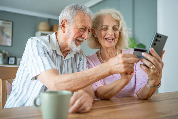 istock Senior couple buying online and using a credit card 2161635751