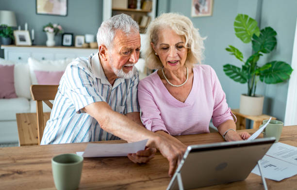 istock Senior couple managing home budget 2161636116