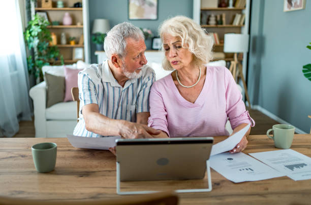 istock Senior couple managing home budget 2161636125