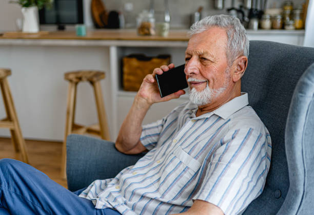 istock Senior man having a phone call at home 2161636228