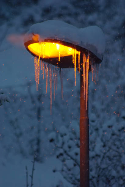 street lamp with icicles attached in winter