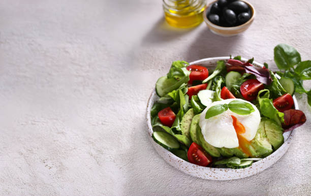 istock fresh salad with poached egg and avocado 2161639514