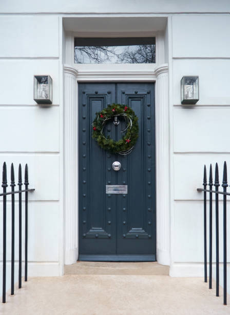 Victorian Navy Door in London, England with a Traditional Christmas Wreath and Railings.