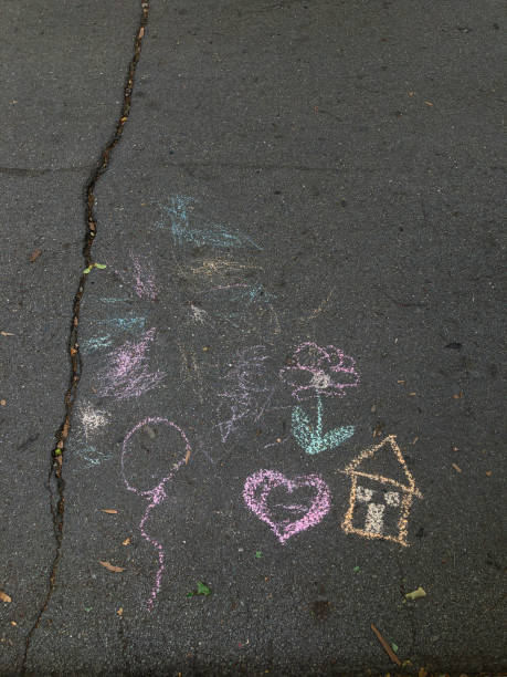 istock Children's chalk drawings on asphalt 2161641843