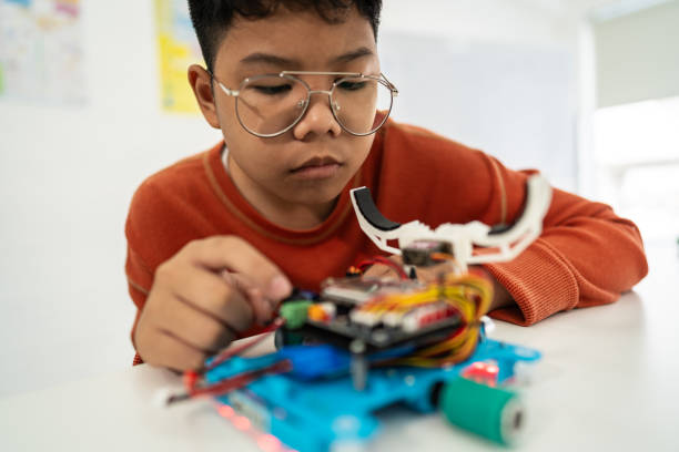 istock Primary education Students and friends learning Robotics technology in classroom with teacher 2161642493