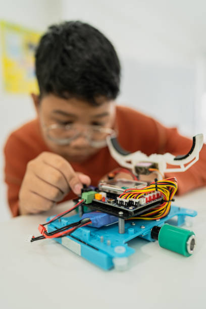 istock Primary education Students and friends learning Robotics technology in classroom with teacher 2161642582