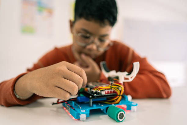 istock Primary education Students and friends learning Robotics technology in classroom with teacher 2161642687
