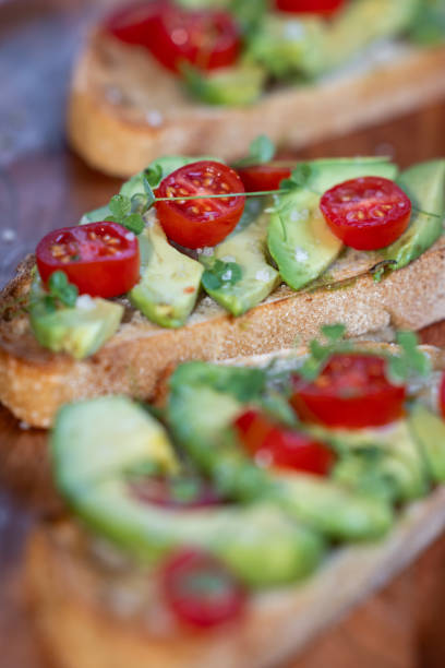 istock avocado toast topped with tomato and sprouts 2161642984