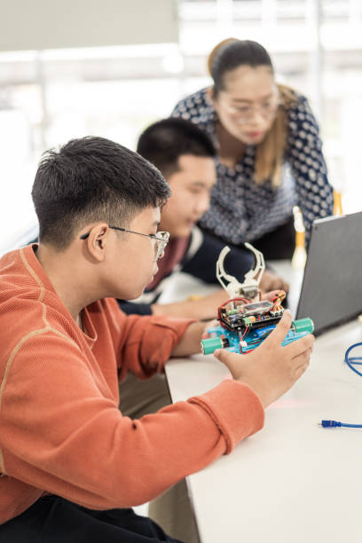 istock Primary education Students and friends learning Robotics technology in classroom with teacher 2161644246