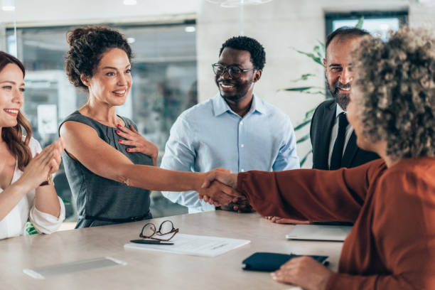 istock Shaking hands with new colleague 2161645165