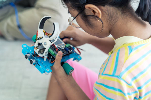 istock Primary education Students and friends learning Robotics technology in classroom with teacher 2161645762