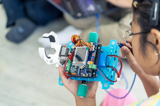 Young Students and friends learning Robotics technology in classroom with fun and happiness.