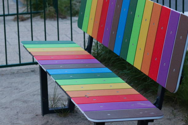istock A bench in rainbow colors on the playground 2161647756
