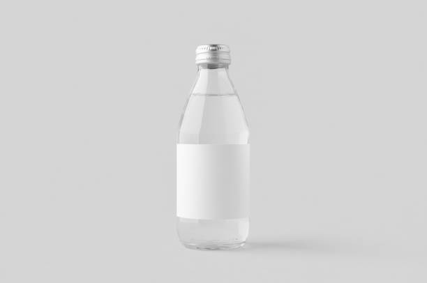 istock Small water bottle mockup with blank label. Clear glass. 2161652734