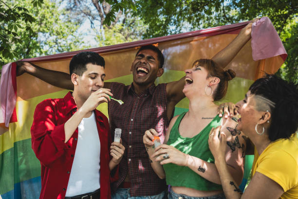 istock Friends playing soap bubble public park 2161652828