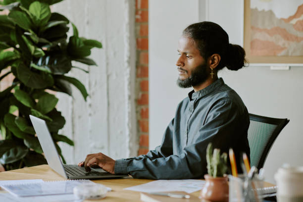istock Young Indian Man Surfing Internet 2161653056