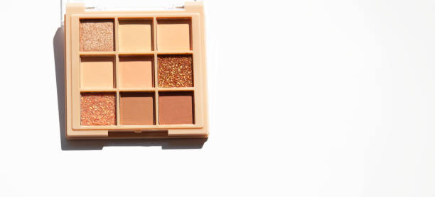 istock Makeup palette on white. Professional makeup eyeshadow palette in beige and brown shades. 2161653532