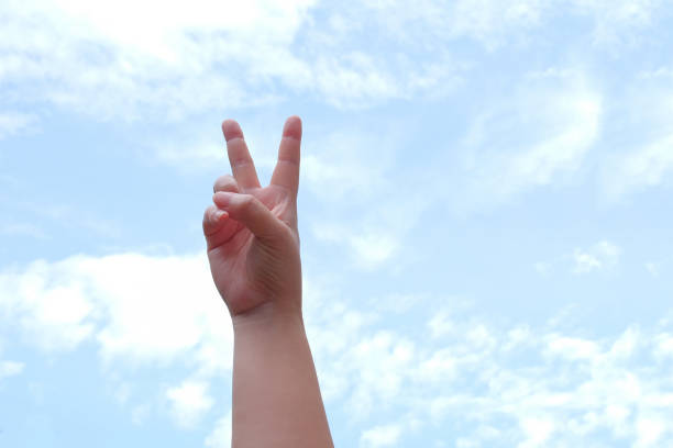 istock Woman hand showing something on the sky. 2161654129