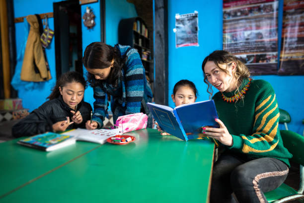 istock Teachers assisting students in the classroom at a children's foundation 2161654573