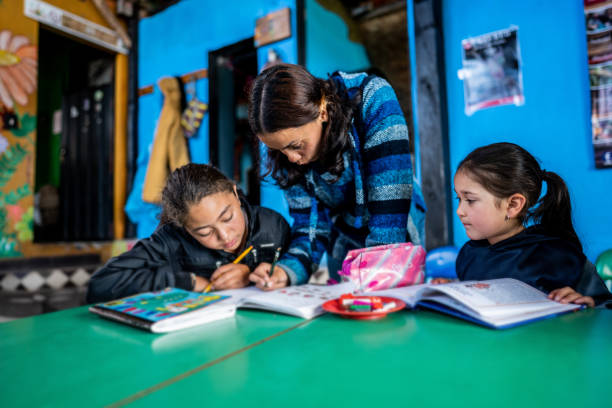 istock Teacher helping students in the classroom at a children's foundation 2161654574