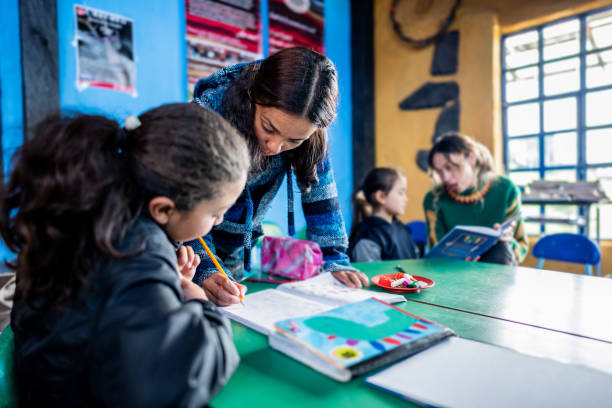 istock Teacher assisting student in the classroom at a children's foundation 2161654586