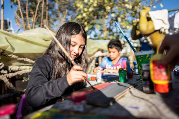 istock Child doing painting activity at children's foundation 2161655017