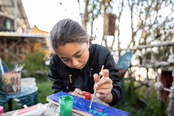 istock Child doing painting activity at children's foundation 2161655151