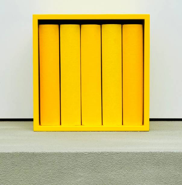Yellow generic books in a yellow square shelf
