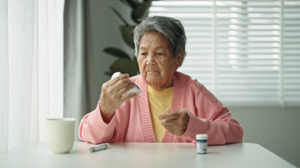 istock Elderly patient with diabetes using blood glucose meter. 2161658692