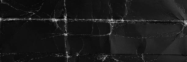 istock Black old paper with folds and roughness 2161659642