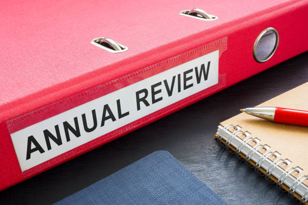 istock Big folder with annual review and notebooks. 2161659876