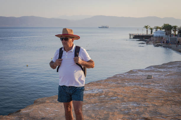 A tourist explores a seaside tourist destination