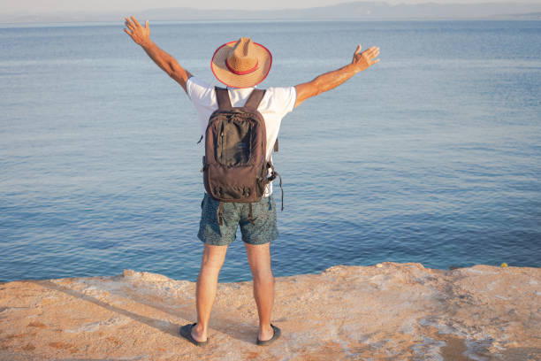 Happy tourist on the seashore