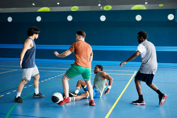 istock Two men fighting at a basketball game 2161662724