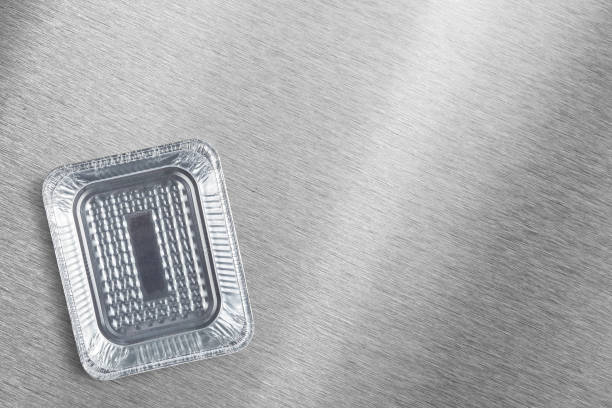 An Empty aluminum disposable tray top view on a metal countertop