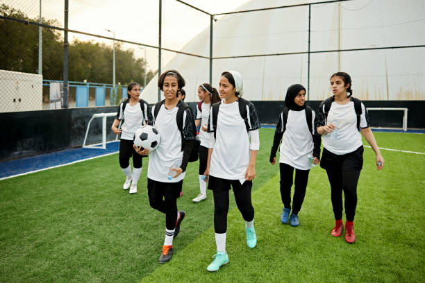 istock Middle eastern female soccer team walking on field 2161667645