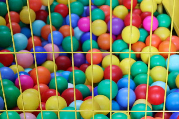 istock Colorful balls in the pool. Background with balls, writing board. 2161672112