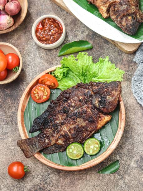 istock Ikan bakar, charcoal-grilled fish or other forms of seafood. 2161673455