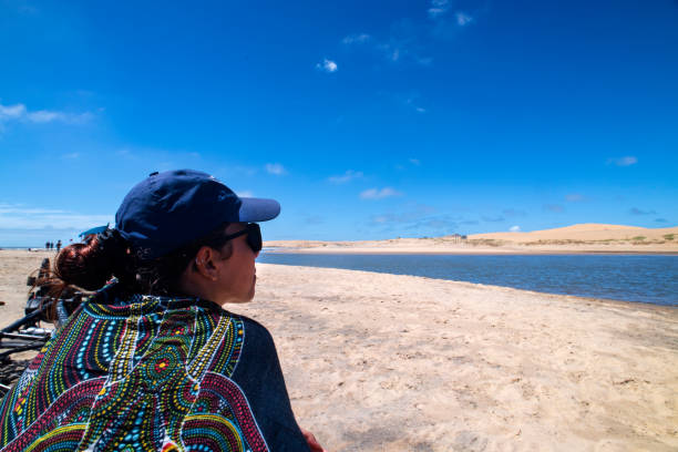 Woman on Valiza beach in Uruguay on a summer day