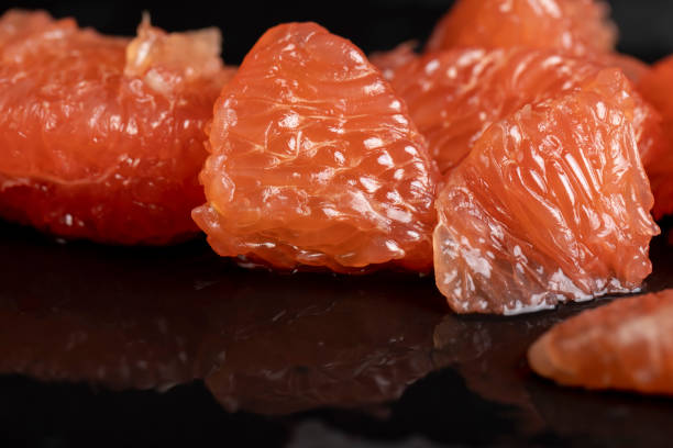 istock slices of peeled grapefruit close-up 2161679696