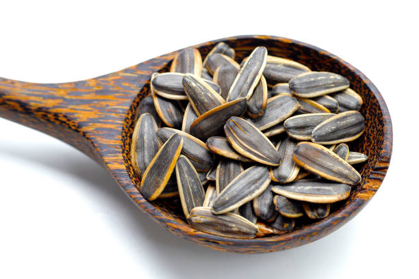istock Roasted sunflower seeds on white background. 2161680418