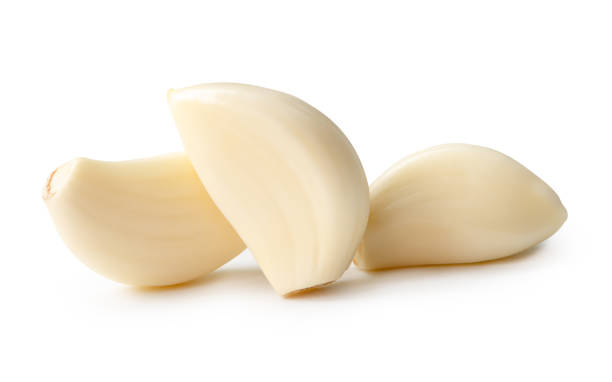 istock Front view of peeled garlic cloves in stack isolated on white background with clipping path 2161681519