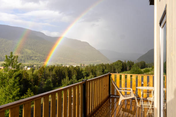 Landscape of amazing rainbows with wooden viewing deck and ladders at sunrise