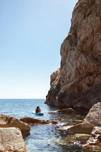 istock Enjoying the paddle board at sea 2161684868