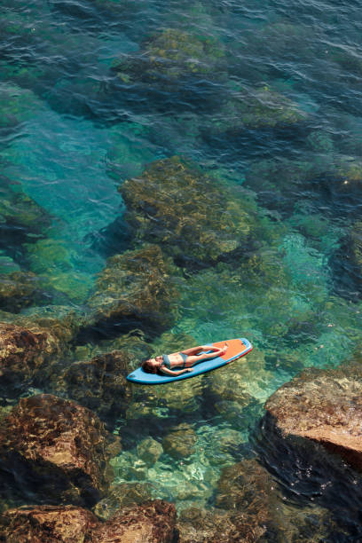istock Enjoying the paddle board at sea 2161684876
