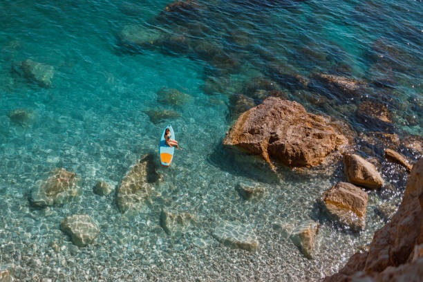 istock Enjoying the paddle board at sea 2161684881